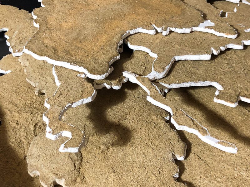 Kontinente mit Sandgrundierung